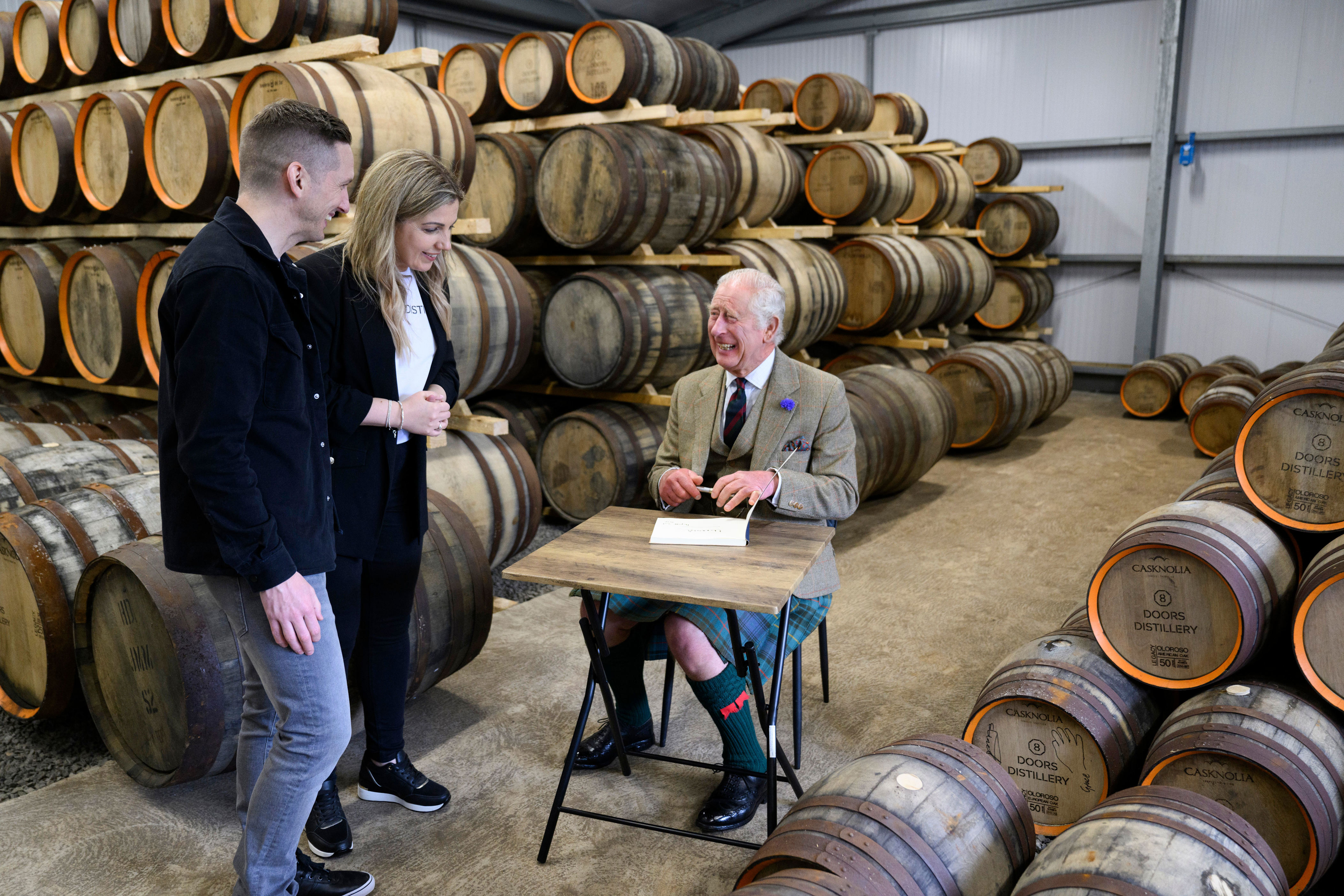 <p>A kilted King Charles III signed the visitors book as he officially opened 8 Doors Distillery in John O'Groats in Wick, Scotland -- the most northerly mainland whisky distillery in Britain -- on Aug. 2, 2023.</p>