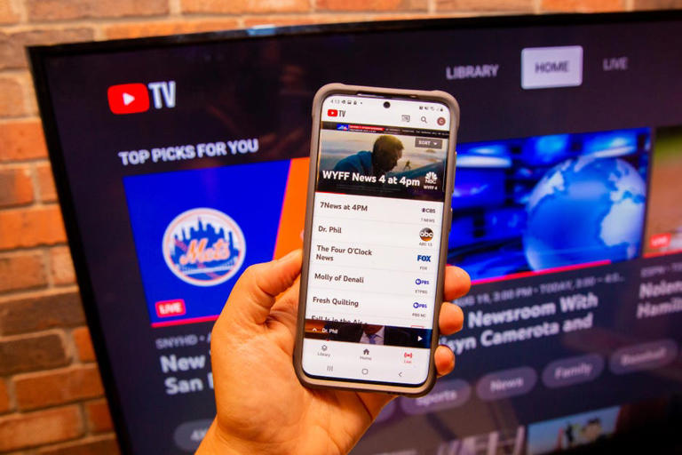YouTube TV on a phone that's connected to the app on a television. Sarah Tew/CNET