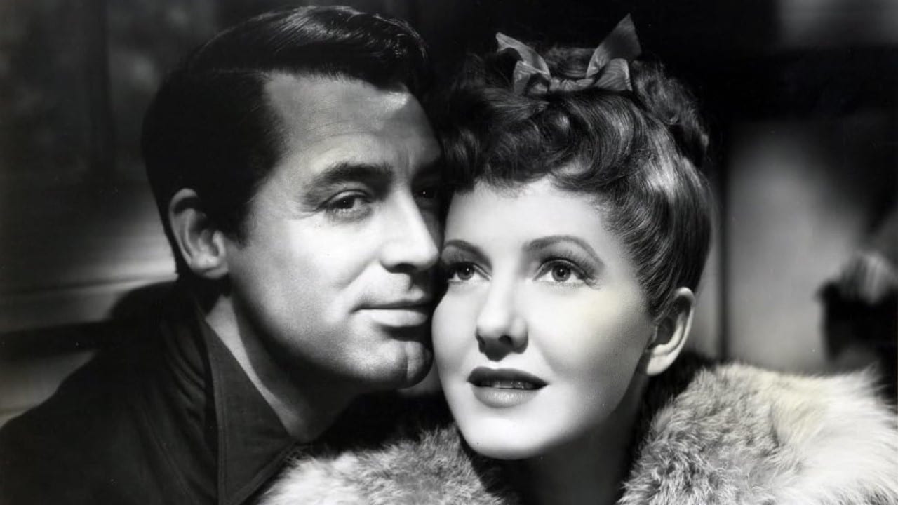 <p><span>Many of Grant’s films combine comedy with drama, adding depth to the film’s themes on society. That may be a coincidence or a case of the studio knowing Grant could convey these things beautifully. Co-starring Jean Arthur and Ronald Coleman,</span><em><span> The Talk of the Town</span></em><span> presents a thoughtful examination of compassion, critical and instinctual thinking, corruption, and the dangers of ignorant mob mentality.</span></p><p><span>In the film, Grant plays a man wrongfully accused and convicted of arson and murder who escapes prison and flees to the home of his childhood friend. He scares her at first but soon helps prove him innocent. With a renter staying at the house, the complicated situation results in hijinks, misunderstandings, and dire circumstances. Well-written and performed, this slow-paced film proves equally effective and entertaining.</span></p>