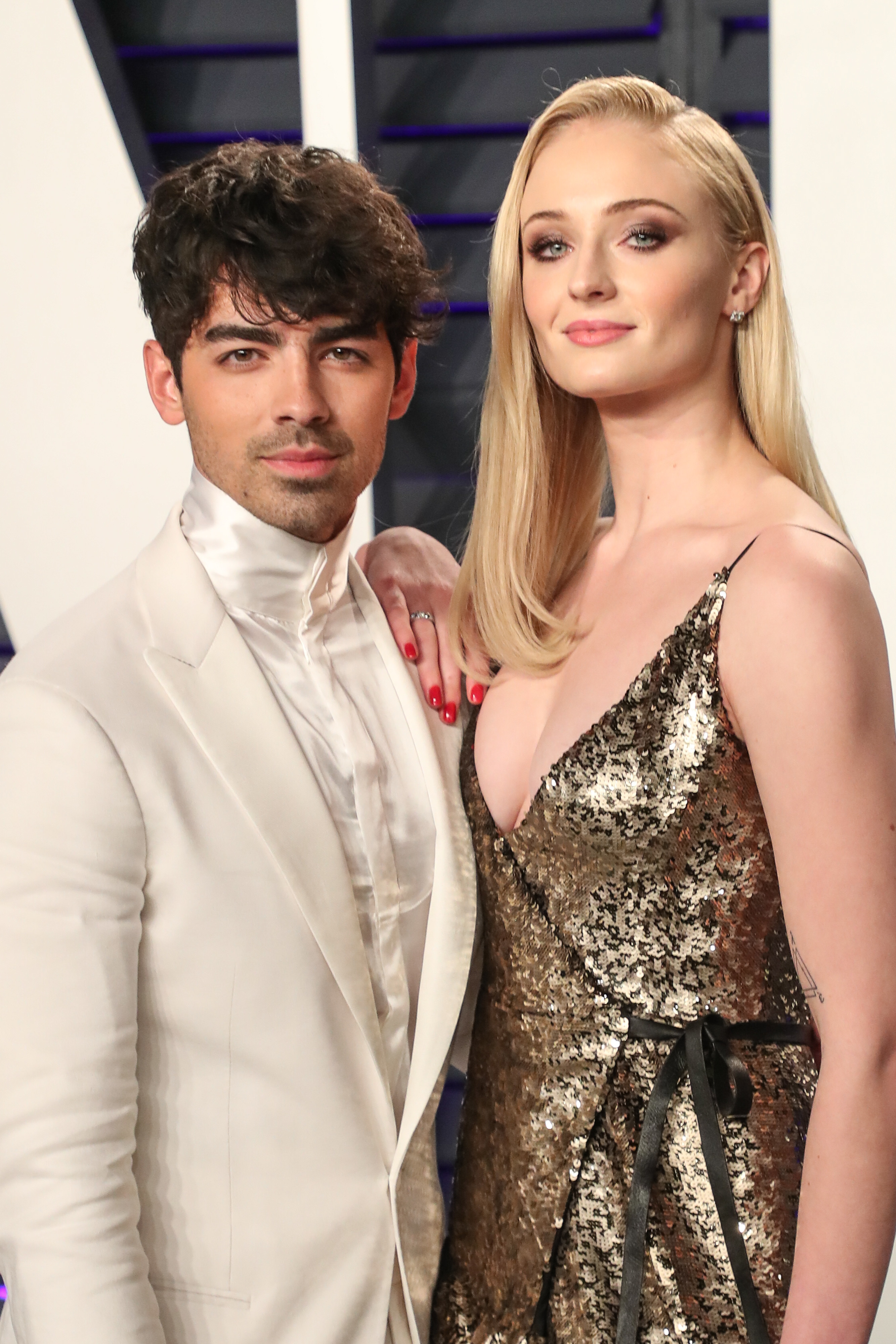 <p><span>"Game of Thrones" actress Sophie Turner was not a fan of <a href="https://www.wonderwall.com/celebrity/profiles/overview/joe-jonas-1225.article">Joe Jonas</a>'s band before she fell for the singer and </span><a href="https://www.wonderwall.com/celebrity/couples/joe-jonas-sophie-turner-married-las-vegas-wedding-celeb-love-life-news-early-may-2019-hollywood-romance-report-3019429.gallery">married him</a><span>. "There was this band in the U.K. called Busted. They had a hit called 'Year 3000.' It was amazing, and [my friends and I] were huge Busted fans. Then the Jonas Brothers covered the song and made it massive. And Busted broke up. We thought it was all the Jonas Brothers' fault. So we hated them," she told ELLE magazine in 2020. </span></p><p>Then in 2016, a producer on one of her films who'd once lived next door to the JoBros told her, "You should meet <a href="https://www.wonderwall.com/celebrity/profiles/overview/joe-jonas-1225.article">Joe Jonas</a>. I feel like you would really get along with this guy." Shortly after that, "I went to a meeting, and Joe's agent was in the room. And he was like, 'You remind me of one of my clients. I bet you two would really hit it off,'" she recalled.</p><p>Later that year, Sophie told ELLE, Joe sent her a DM on Instagram out of the blue -- he was going to be in Britain and wanted to meet up. "When I told my friends, they were like, 'That's hilarious. You have to do it! And you have to text us everything he says,'" she said. "I expected him to show up with security and everything. I thought, 'He's gonna be such a d***,'" she told ELLE. "I brought all my guy friends to come with me to meet him, because in the back of my mind I still worried that he could be a catfish -- or I don't know what. I just wanted my guy friends with me. I had my rugby boys. I was safe." </p><p>They met at a bar in London's Camden area and Joe didn't bring security -- just a friend -- "and they drank just as hard as the rest of us," Sophie recalled. "I remember the two of us spending only a couple of minutes on the dance floor, and then we just found a space far in the corner and we just talked. We talked for hours and hours and hours. And I was, like, not bored. It wasn't contrived. It wasn't small talk -- it was just so easy. And soon we were, like, inseparable. I went on tour with him." </p><p>They then got engaged on their one-year anniversary in 2017, wed in 2019 and welcomed two daughters before things went south in 2023 and Joe filed for divorce.</p>