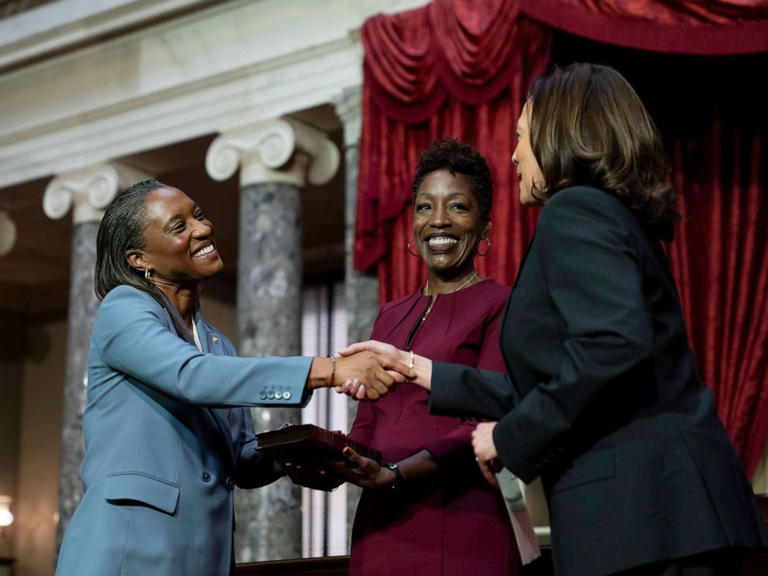 Vice President Kamala Harris, right, swears in Laphonza Butler, left, to the Senate to succeed the late Sen. Dianne Feinstein, during a re-enactment of the swearing-in ceremony, Oct. 3, 2023, on Capitol Hill in Washington.