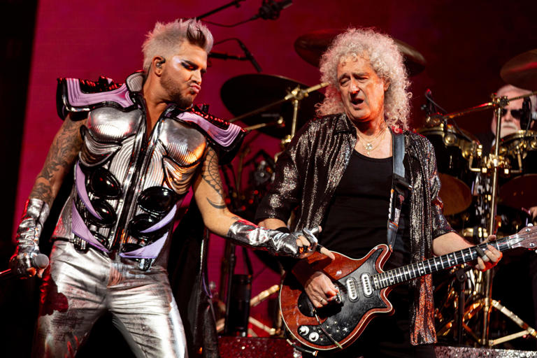Adam Lambert, left, and Brian May, right, perform during the Queen + Adam Lambert Rhapsody Tour at CFG Bank Arena Oct. 4, 2023, in Baltimore.