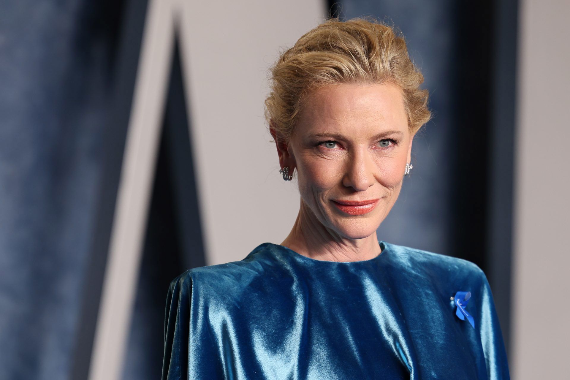 Cate Blanchett looks Hollywood chic in a red pant suit as she dons