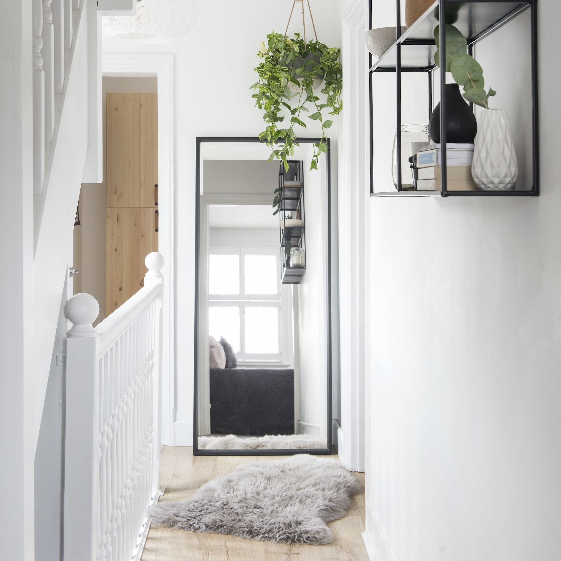 <p>                     The narrow space at the end of a landing is often just the right size for a full length mirror. This is a brilliant way to increase the amount of natural light on your landing, reflecting it from surrounding windows.                   </p>                                      <p>                     It also provides the opportunity for a last minute outfit check, before you head out of the door.                   </p>