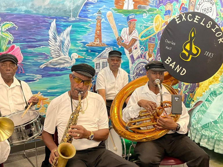 The Excelsior Band perform for visitors to the Alabama Cruise Terminal ahead of the Carnival Ecstasy's final cruise voyage on Monday, October 10, 2022. The band is expected to return to the terminal to welcome the Carnival Spirit on Friday, Oct. 6, 2023.