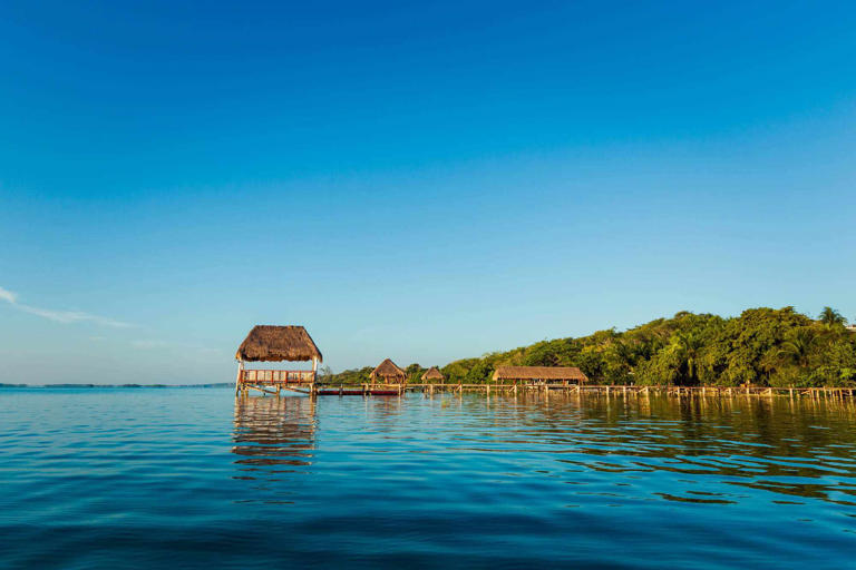 With travelers flooding to popular destinations, consider more off-the-beaten track destinations, like the stunning (and quiet) Laguna Balacar in Mexico.