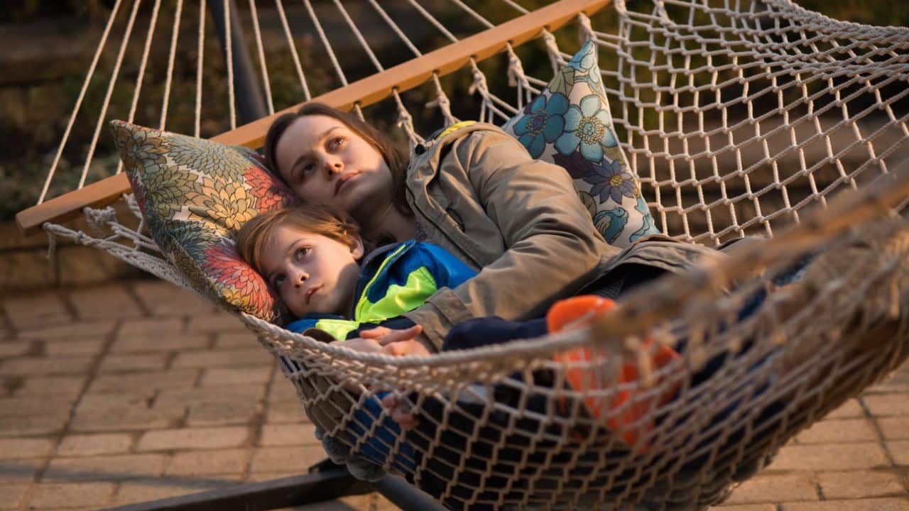 <p><em>Room </em>is a drama following a young woman (<a href="https://wealthofgeeks.com/is-captain-marvel-feminist-white-feminism/">Brie Larson</a>) who is held captive for seven years. While in captivity, she births her son, who knows only one way of life for five years. After they escape, her son experiences the world around the room for the first time. </p>