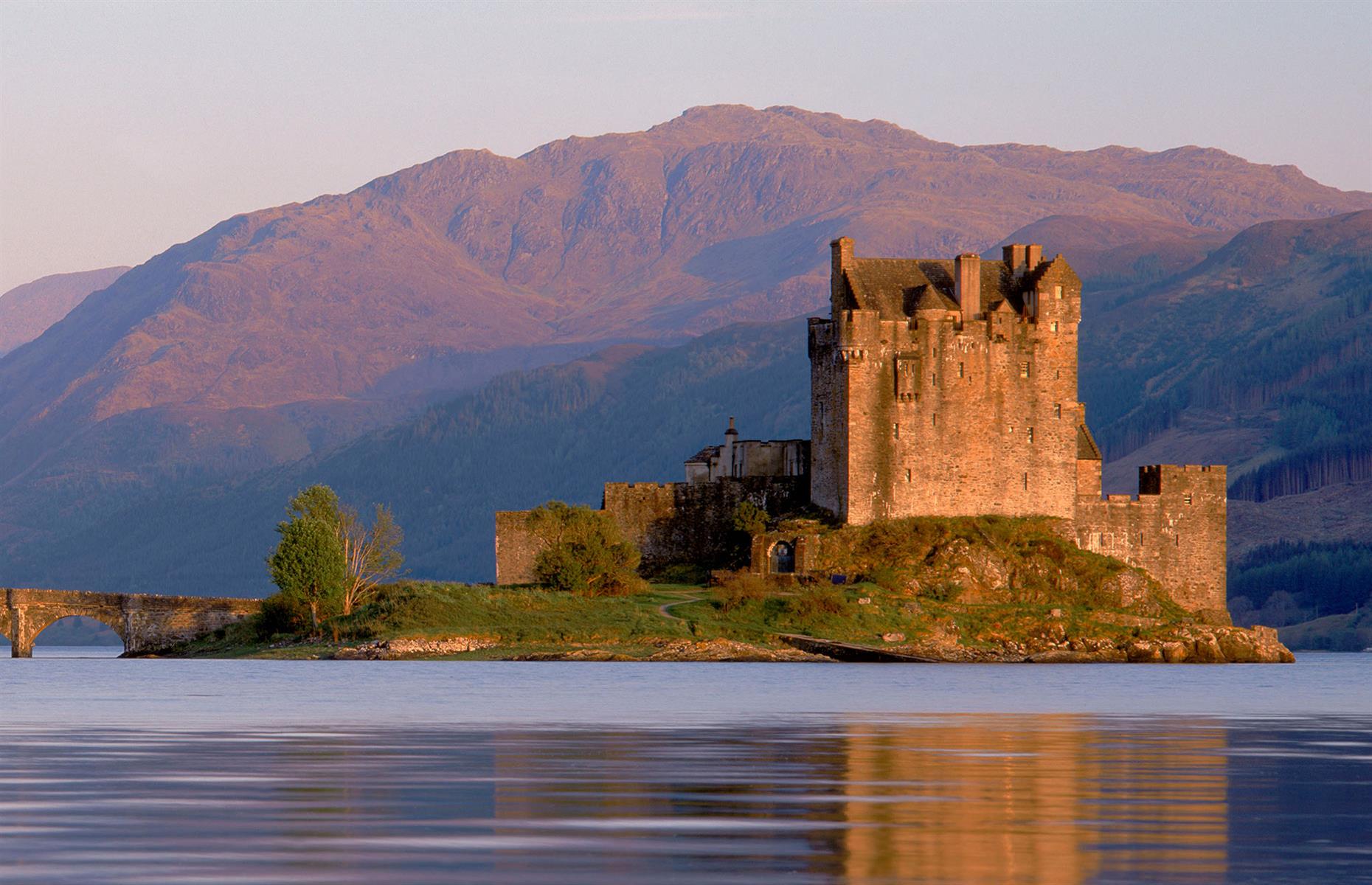 <p>If you are travelling to Skye via the Skye Bridge, the chances are you will pass this <a href="https://www.eileandonancastle.com/">castle</a>, which is one of the most atmospheric in all of Scotland, making it the country's most photographed. The setting helps – sitting at the confluence of three lochs with the hills of Kintail as a backdrop, it's the perfect shortbread-tin view of Scotland, and looks as though it has stood just like this for centuries.</p>
