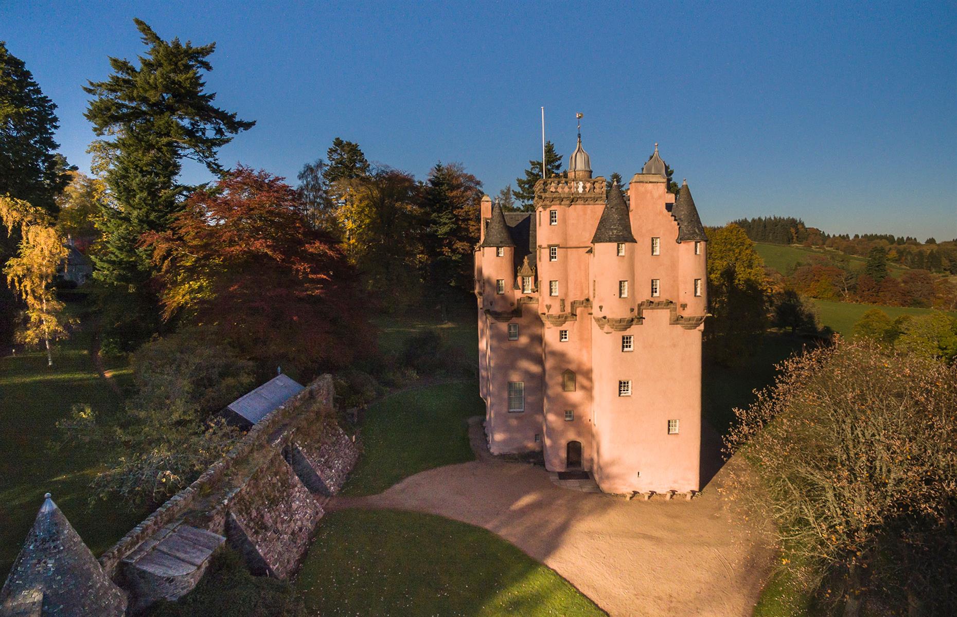 <p>This pretty-in-pink <a href="https://www.visitscotland.com/info/see-do/craigievar-castle-p248301">castle</a> is like the realisation of a Disney fantasy. Built in the Scottish Baronial style around 1576, it is said that Craigievar's towered fortress with its numerous turrets, provided some inspiration for Walt Disney’s Cinderella Castle (although this is hotly disputed with Neuschwanstein Castle in Germany). It certainly looks the part, and remarkably the exterior or the property remains virtually unchanged since it was completed in 1626.</p>