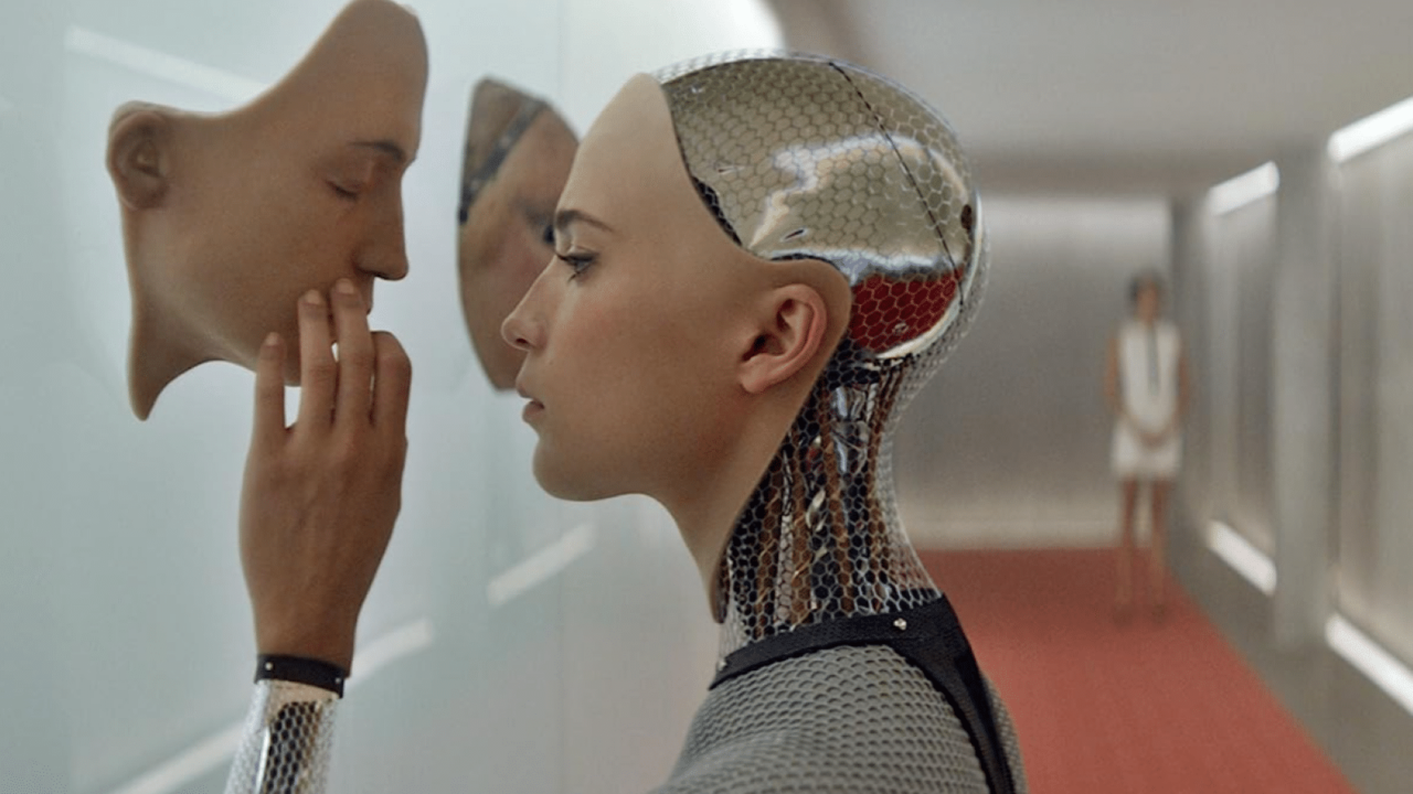 <p>Acclaimed science fiction author Alex Garland made an impressive directorial debut with his sleek <em>Ex Machina</em>. The film follows Caleb, a programmer at a huge internet company, who wins a contest to spend the week at the mountain retreat of Nathan, the company’s Elon Musk-style CEO. Once Caleb arrives at the reclusive site, he finds he was chosen to participate in an experiment with Nathan’s advanced A.I. robot housed in the body of a young girl he calls Ava. But things turn sinister when Ava warns Caleb that Nathan has gone insane and his life is in danger.</p><p>With only three principal characters, <em>Ex Machina</em> has the intimacy of a one-act play. The film starts as a sly commentary on the tech bro culture of Silicon Valley through Nathan’s unhinged antics. But the tension ramps up when Ava turns the movie upside down with her warning about Nathan and his plans for Caleb. Is Ava telling the truth or manipulating the young Caleb into releasing her from her wired prison? It’s a plot twist worthy of Alfred Hitchcock.</p>