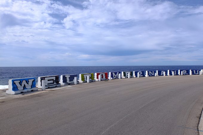 Welcome to Nauru sign on concrete barriers