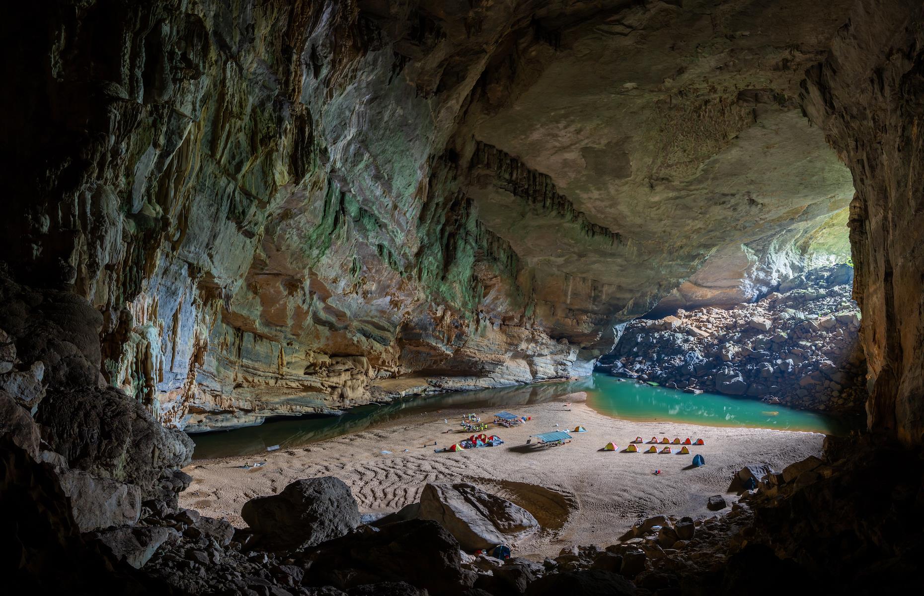 <p>Vietnam is full of awe-inspiring beauty but Son Doong Cave in Phong Nha-Ke Bang National Park takes it to another level. The main passage of this vast cavern is just over three miles (5km) long, with parts of it reaching up to 656 feet tall (200m) and 541 feet wide (165m). In total it’s over five-and-a-half miles (9km) long. Even more mind-blowing is that within its depths lie a primeval rainforest and underground river, and it has its own microclimate. You can’t just wander in, however. The cave can only be explored on a guided tour, and numbers are limited to 1,000 visitors a year to protect this extraordinary and fragile natural wonder.</p>