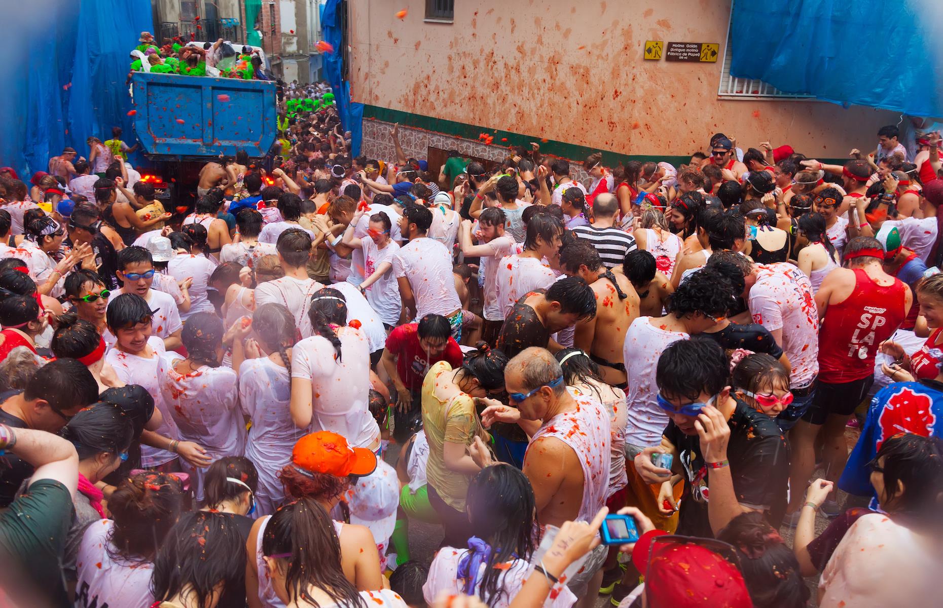 <p>If you hate food waste, look away now. Each year in Bunol, near Valencia in Spain, 20,000 people gather to lob around 150,000 kg of tomatoes at each other in the streets during La Tomatina, billed as the world's largest annual food fight. The curious festival has its origins in an innocuous tomato slinging fight that took place at a street parade in 1945 and became a tradition. The now world-famous spectacle is held on the last Wednesday of August and attracts tens of thousands of people every year.</p>