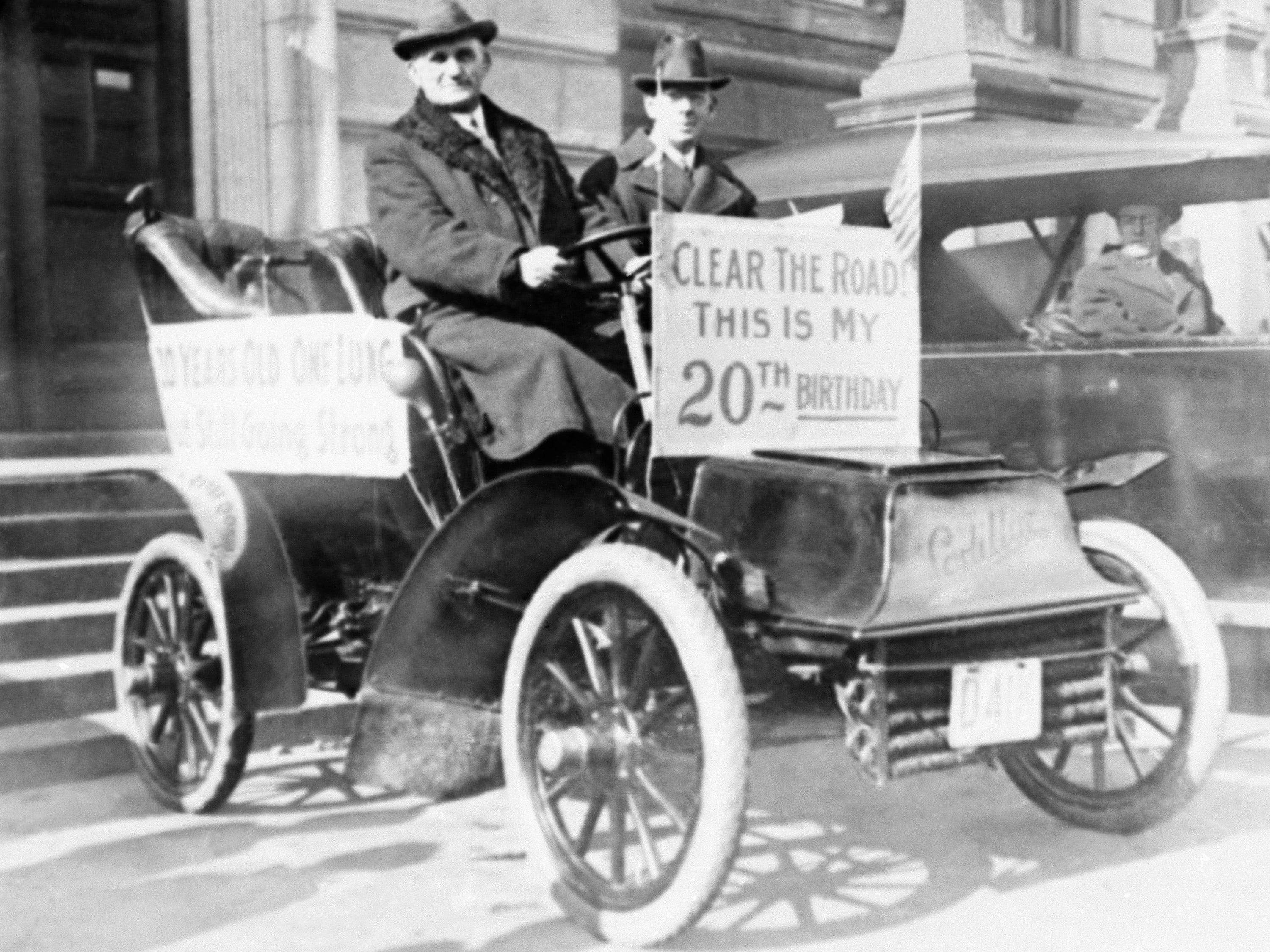 <p>Mayor Charles F. Sullivan of Worcester, Massachusetts, held up a sign that said, "Clear the road! This is my 20th birthday" while taking a drive in 1923.</p>