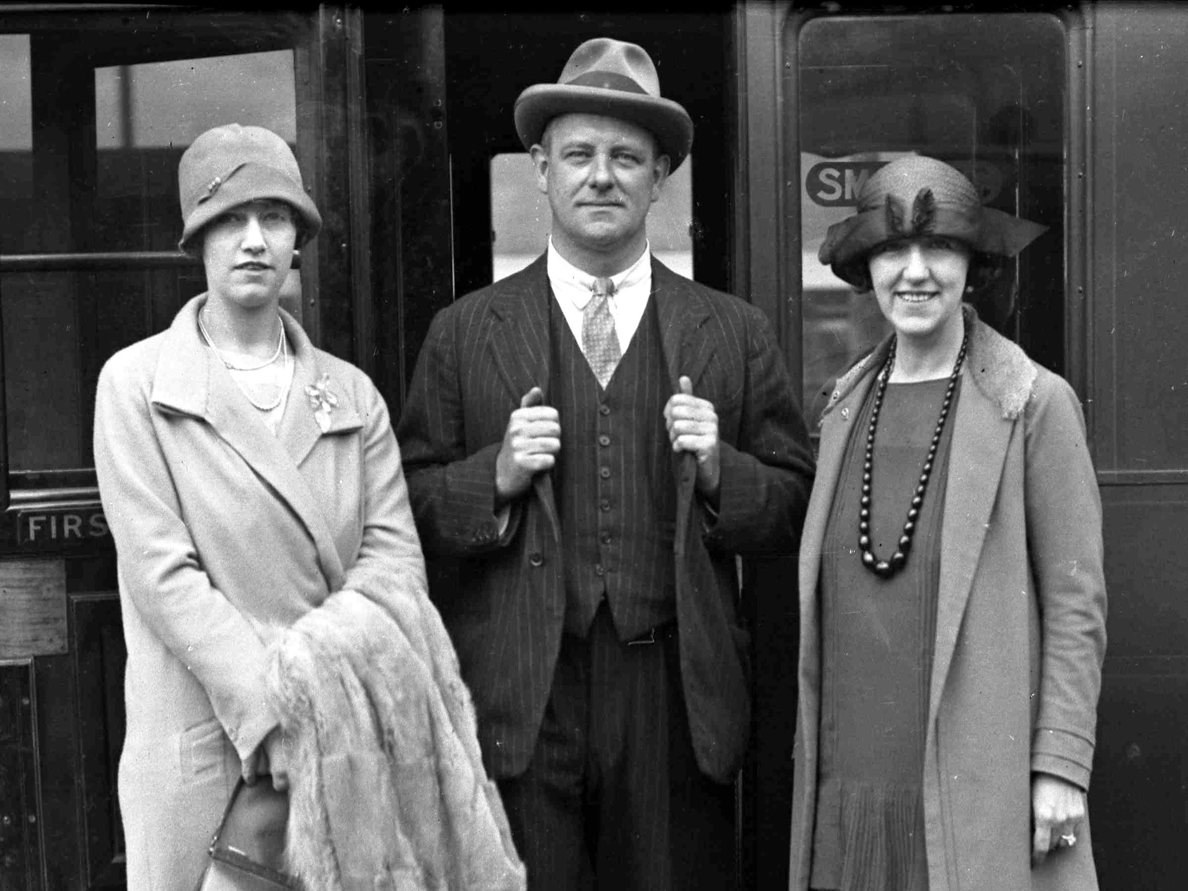 <p>British author P.G. Wodehouse was photographed leaving for a family vacation from Waterloo Station in London in 1929 wearing a three-piece pinstripe suit.</p>