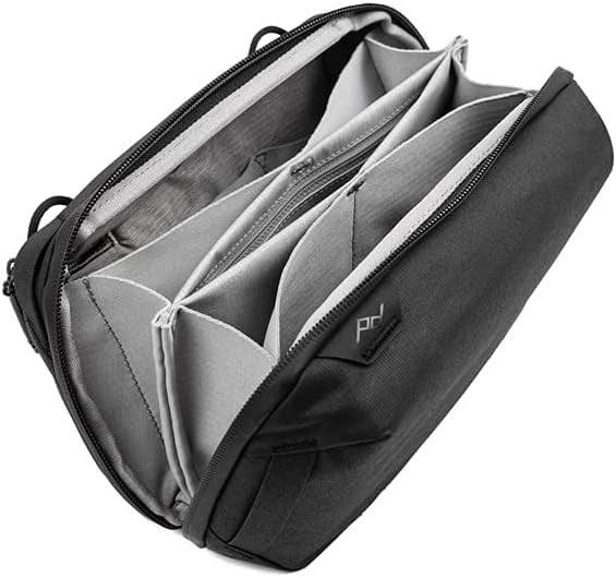 <p><a href="https://www.amazon.com/Peak-Design-Pouch-Black-BTP-BK-2/dp/B095JR154M/">BUY NOW</a></p><p>$60</p><p><a href="https://www.amazon.com/Peak-Design-Pouch-Black-BTP-BK-2/dp/B095JR154M/" class="ga-track"><strong>Peak Design Tech Pouch</strong></a> ($60) </p> <p>Peak Design's tech pouch with a clamshell-style opening features origami-like pockets that maximize spatial efficiency.</p> <p><strong>Why we love it:</strong> This tech pouch has it all - ample pockets (including pockets within pockets), elastic loops, exterior handles, and a detachable strap (sold separately). An exterior pocket even has a cable pass-through so you can easily charge devices in the pouch without having cords dangling through the zipper. And it's made from water-resistant, weather-proof recycled nylon to keep those devices, chargers, and other items safe.</p> <p><strong>What to keep in mind: </strong>There are a whole lot of compartments in this tech pouch. While it's ideal for anyone who has a lot of pieces of gear they want to keep organized, it may not be necessary to have so many separate spaces. For some travelers, a simpler or smaller pouch might be preferred; this one measures ‎about 4 x 9.5 x 6 inches.</p>