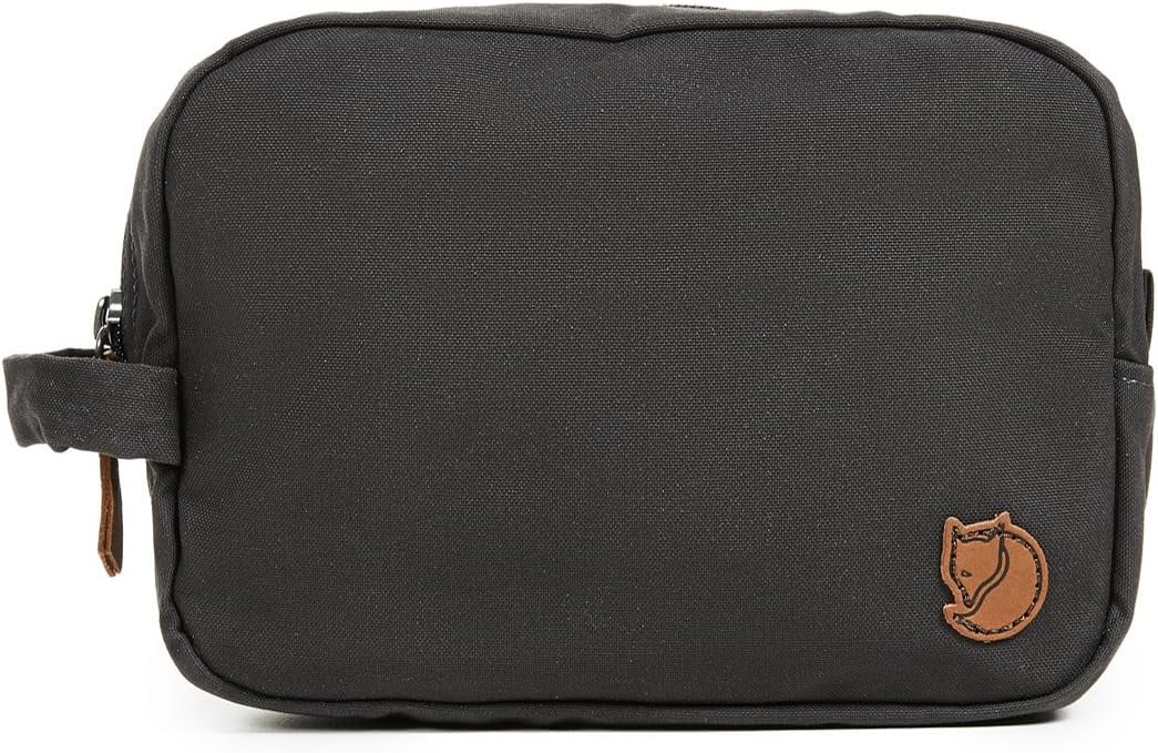 <p><a href="https://www.amazon.com/Fjallraven-F24213-030-Gear-Bag/dp/B00F18YMDM">BUY NOW</a></p><p>$31</p><p><a href="https://www.amazon.com/Fjallraven-F24213-030-Gear-Bag/dp/B00F18YMDM" class="ga-track"><strong>Fjällräven Gear Bag</strong></a> ($31, originally $35)</p> <p>Fjällräven is a GOAT when it comes to travel gear like backpacks and cases. The company boasts lifetime repairs and free returns, but its multifaceted gear is made with heavy-duty material that makes sure you won't want to send your stuff back.</p> <p><strong>Why we love it: </strong>This gear bag is reasonably priced for one that doubles as a toiletry bag or first aid kit. It's made of a durable, double-waxed G-1000 HeavyDuty material (organic cotton and recycled polyester) with a YKK zipper to protect whatever is inside from the elements. Plus, it's produced without <a href="http://www.cdc.gov/biomonitoring/pdf/pfcs_factsheet.pdf" class="ga-track">PFCs</a> and it's just plain plain, which I prefer as a minimalist.</p> <p><strong>What to keep in mind:</strong> The bag is only two liters in volume, so it may not hold every piece of gear you've got. After all, there's only one main compartment with a zippered pocket and two open compartments. While it's been engineered to adventure with you, it could be tough to keep clean, too. You shouldn't wash, dry clean, or tumble dry the pouch; instead you can scrub it with a soft brush and warm water.</p>
