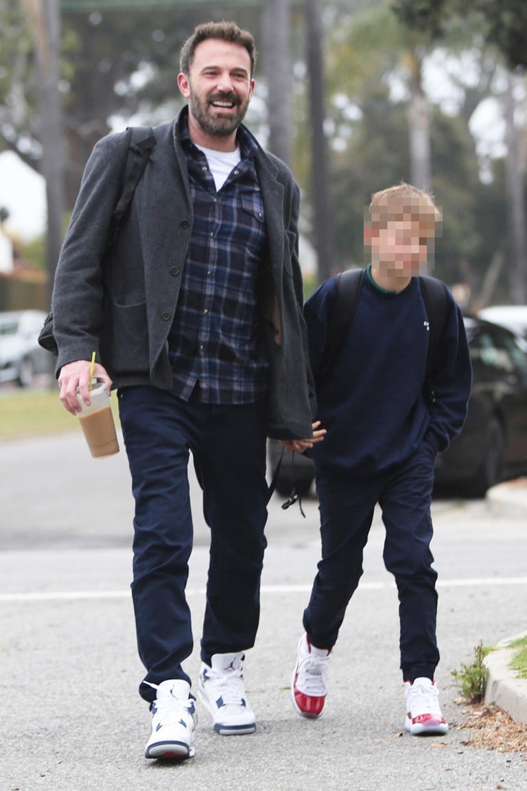 Ben Affleck and his son Samuel walk outside. The actor was all smiles. 