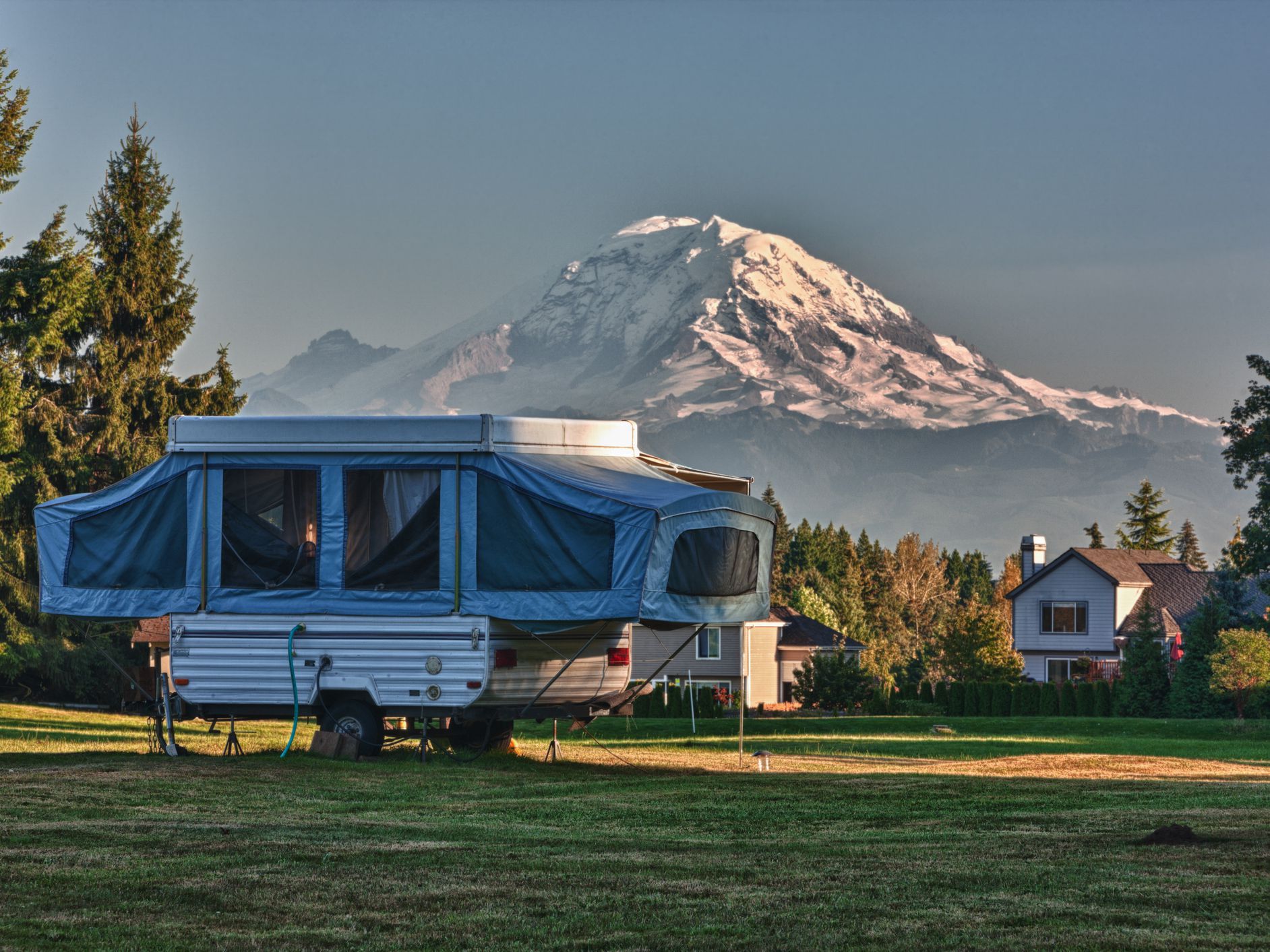 Light enough to tow with family vehicles, pop-up campers extend up and out to transform into big tents that don’t have to touch the ground. They have a hard base and canvas body and have been the staples of budget-minded camping families for generations.