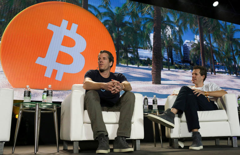 Tyler Winklevoss (L) and Cameron Winklevoss, founders of crypto exchange Gemini Trust Co., attend the crypto-currency conference Bitcoin 2021 Convention at the Mana Convention Center in Miami, Florida, on June 4, 2021. (Photo by Marco BELLO / AFP) (Photo by MARCO BELLO/AFP via Getty Images)