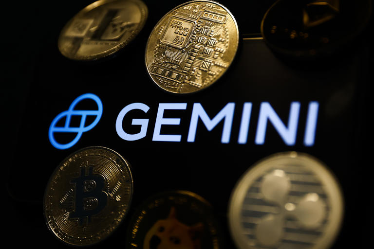 Gemini logo displayed on a phone screen and representation of cryptocurrencies are seen in this illustration photo taken in Krakow, Poland on December 1, 2022. (Photo by Jakub Porzycki/NurPhoto via Getty Images)