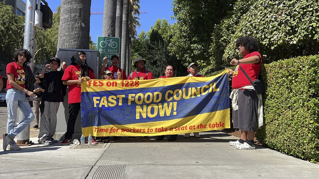 California Gov. Gavin Newsom signs law to raise minimum wage for fast