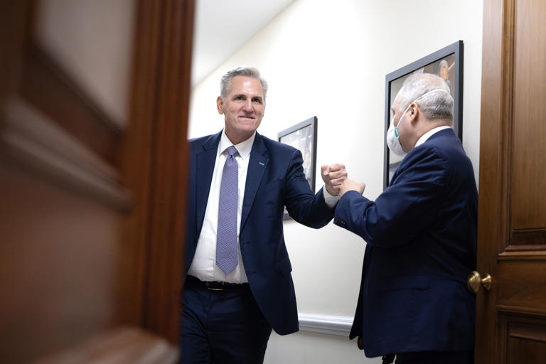 House Speaker Kevin McCarthy (R-Calif.) fist bumps House Majority Leader Steve Scalise (R-La.) before addressing reporters after the House passed a 45-day temporary continuing resolution to keep funding for the government shy of the Saturday midnight deadline.
