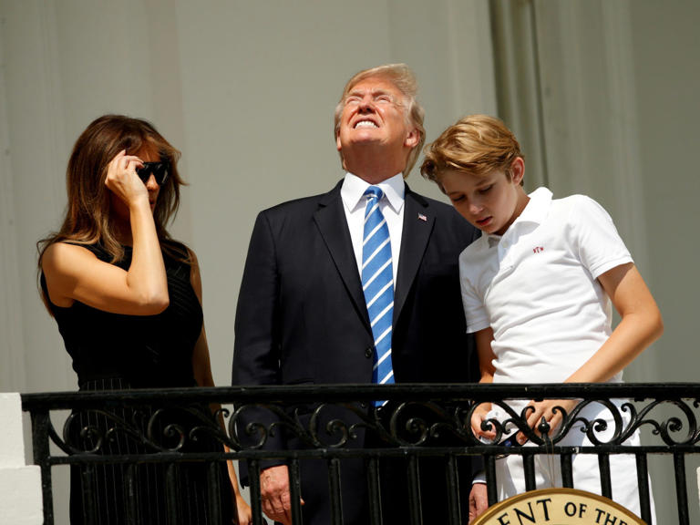 Don't do this. Without his protective glasses on, President Donald Trump looks up towards a solar eclipse with his wife Melania and son Barron at the White House. Kevin Lamarque/Reuters