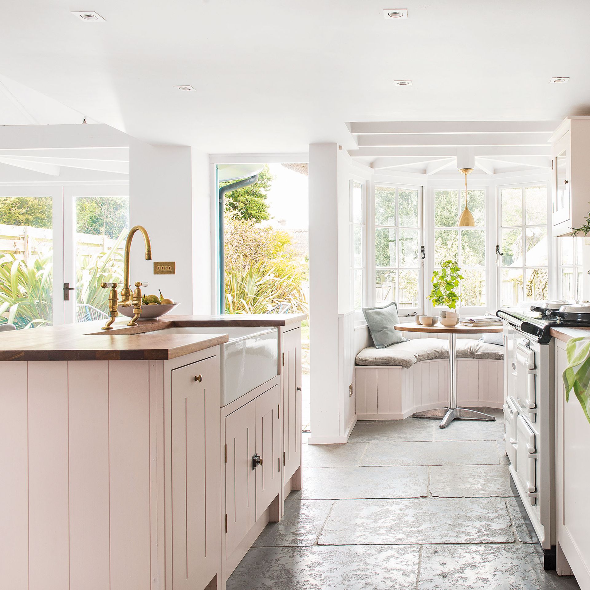 <p>                     All too often people think of country kitchen decor as being dark and pokey. While some tiny cottage with limited windows can suffer from a lack of light, this isn't an issue with the style at large.                   </p>                                      <p>                     Keep country style kitchens light and bright by using the same tips and tricks you would when working out how to make a small kitchen look bigger. Windows are key, and make sure you've really planned out your lighting so there aren't any shadowy corners when the sun goes down. Choose paler tones for the cabinetry, and a white ceiling will help the space seem brighter. Finally, glazed or mirrored surfaces like tiles or hardware will help bounce light around.                   </p>
