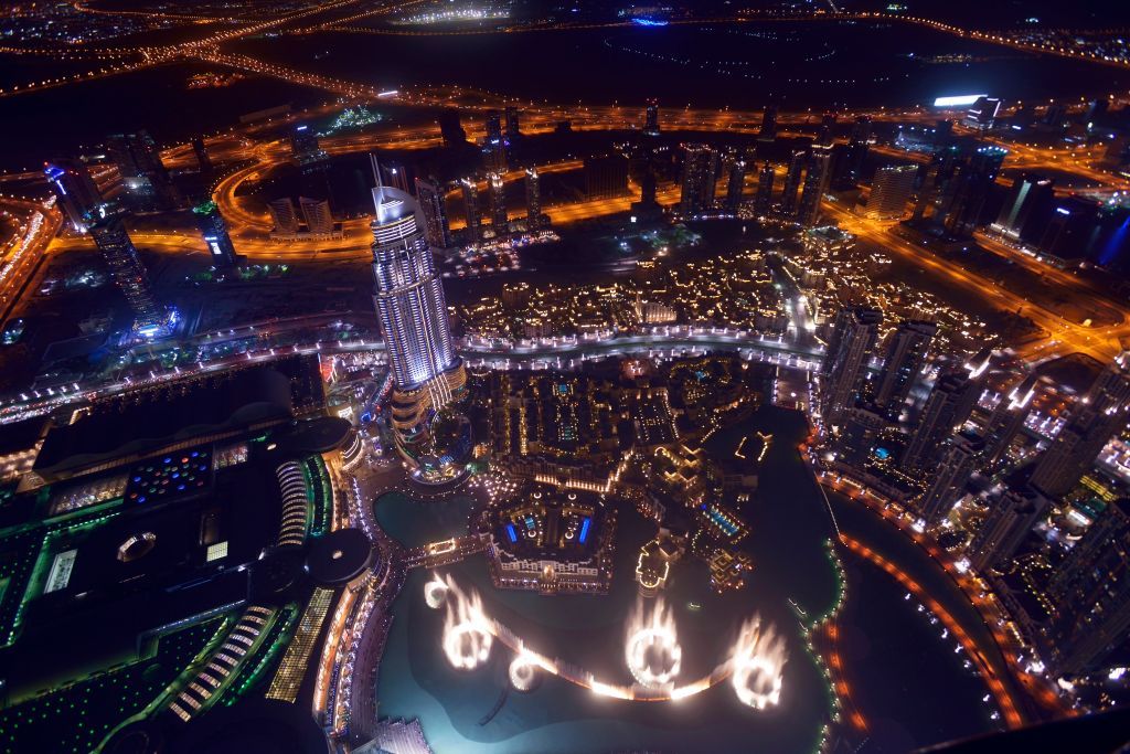 <p>Dubai’s world-renowned Burj Khalifa building can be seen in this aerial photo showing the city at night. Built in 2004, the 2,716-foot building is the current tallest in the world.</p>