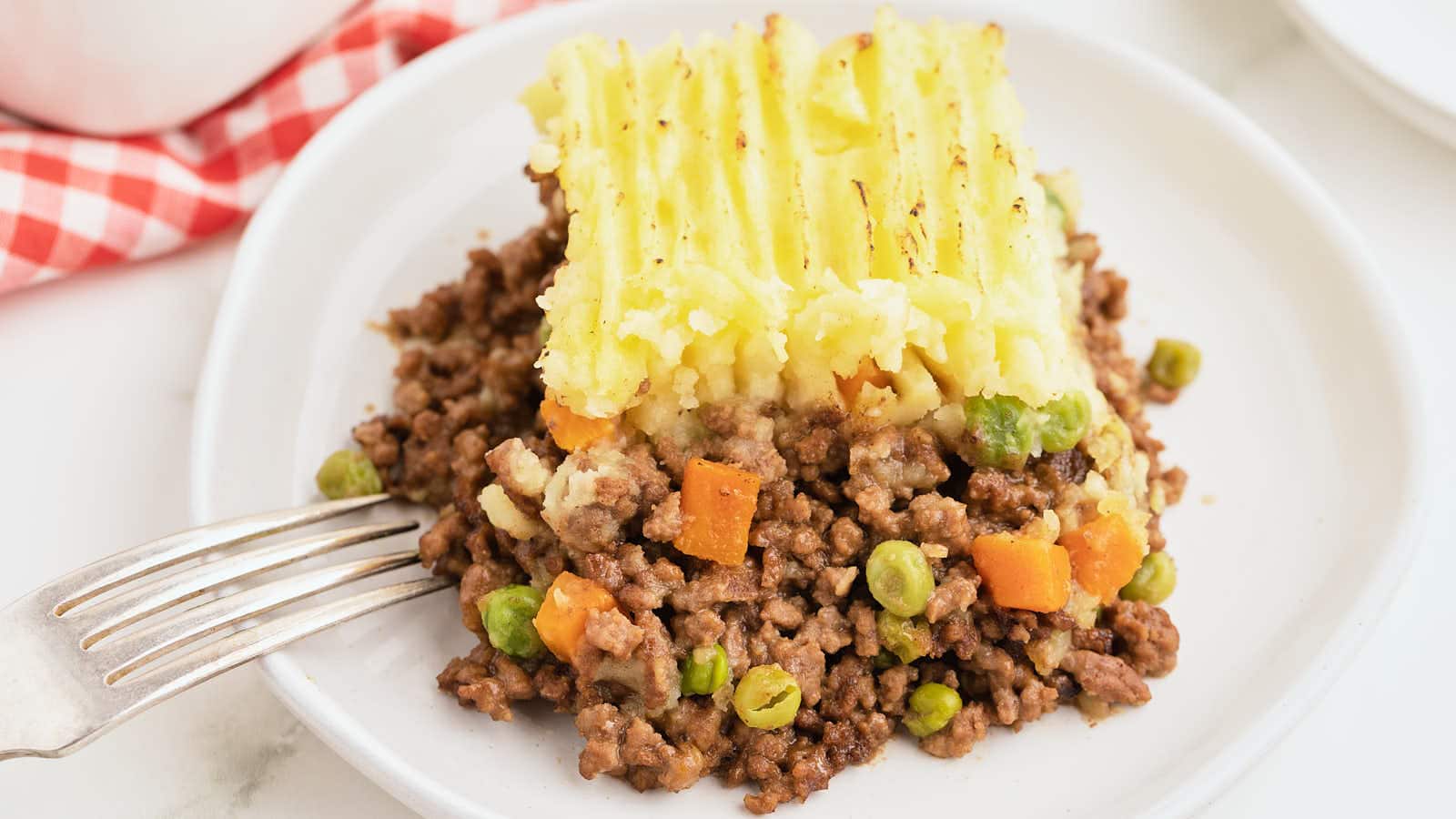 <p>Our easy 1-hour <strong>Shepherd's Pie</strong> is comfort food at its finest, perfect for feeding the whole family. Its hearty layers of ground beef, peas and carrots, and fluffy mashed potatoes make it a crowd-pleaser.</p><p><strong>Get The Recipe:</strong> <strong><a href="https://cheerfulcook.com/easy-shepherds-pie/" rel="noreferrer noopener">Easy Shepherd's Pie</a></strong></p>