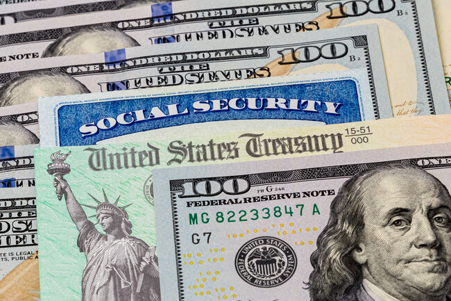 Social Security card, treasury check and 100 dollar bills. Concept of social security benefits payment, retirement and federal government benefits