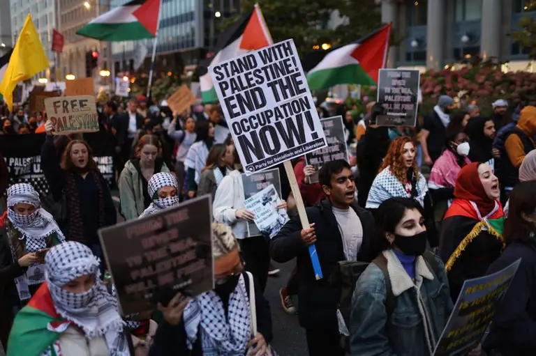 Demonstrators rally and march through downtown to show support for the Palestinian people