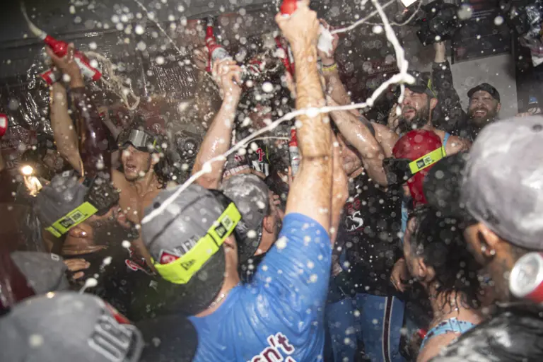 The Phillies celebrate after winning Game 4 of a National League Division Series against the Braves.