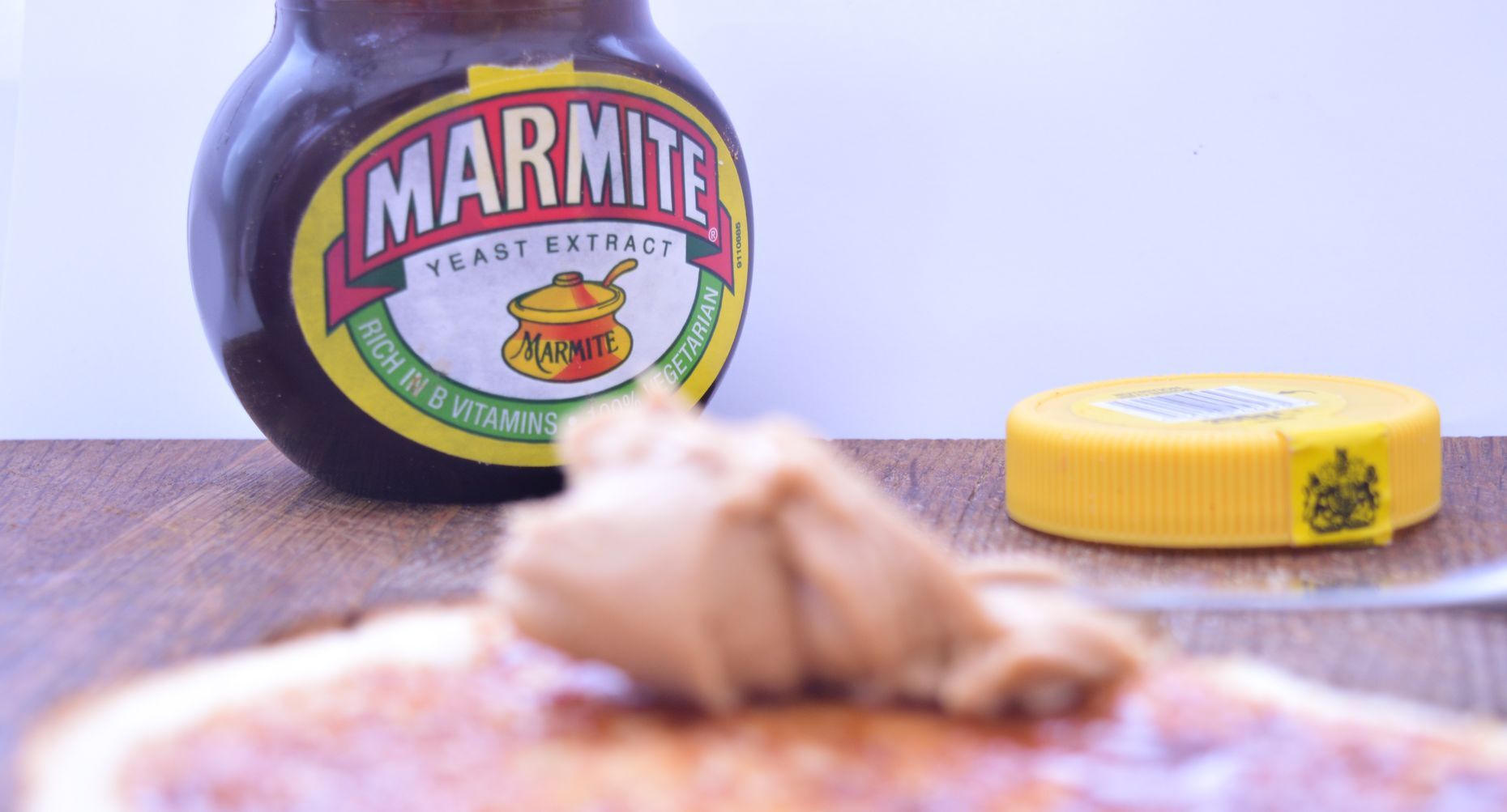 <p>It’s dark brown, yeasty, salty and very much a “love it or hate it” food. <a href="https://www.marmite.co.uk/faq.html" title="https://www.marmite.co.uk/faq.html">Marmite</a>, made from concentrated yeast extract, is a quintessential British food that definitely confuses the rest of the world. Whether they spread it on toast or eat it by the spoonful, Brits are known for their appetite for this divisive condiment, with a survey finding that <a href="https://www.thegrocer.co.uk/hate-marmite-it-turns-out-brits-actually-love-it/238357.article" title="https://www.thegrocer.co.uk/hate-marmite-it-turns-out-brits-actually-love-it/238357.article">47 per cent</a> love this gloopy spread.</p>