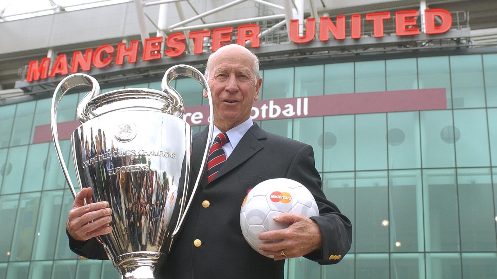 Sir Bobby holds the European Cup outside Manchester United's Old Trafford. Pic: AP