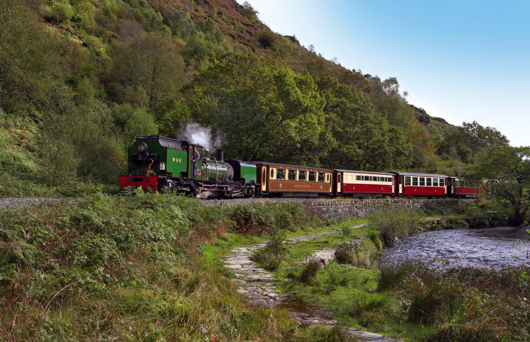 <p>Winding 25 miles (40km) across Snowdonia, the <a href="https://www.festrail.co.uk/">Welsh Highland Railway</a> is the longest heritage railway in the UK. Passing the foot of Snowdon from Caernarfon, the train cuts through the gorgeous Aberglaslyn Pass before arriving at Porthmadog on the Welsh coast where it shares a track gauge with the Ffestiniog Railway.</p>  <p><a href="https://www.loveexploring.com/gallerylist/64254/30-reasons-to-love-wales"><strong>Discover 30 reasons to love Wales</strong></a></p>
