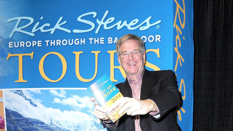 Rick Steves showcasing his Europe travel book