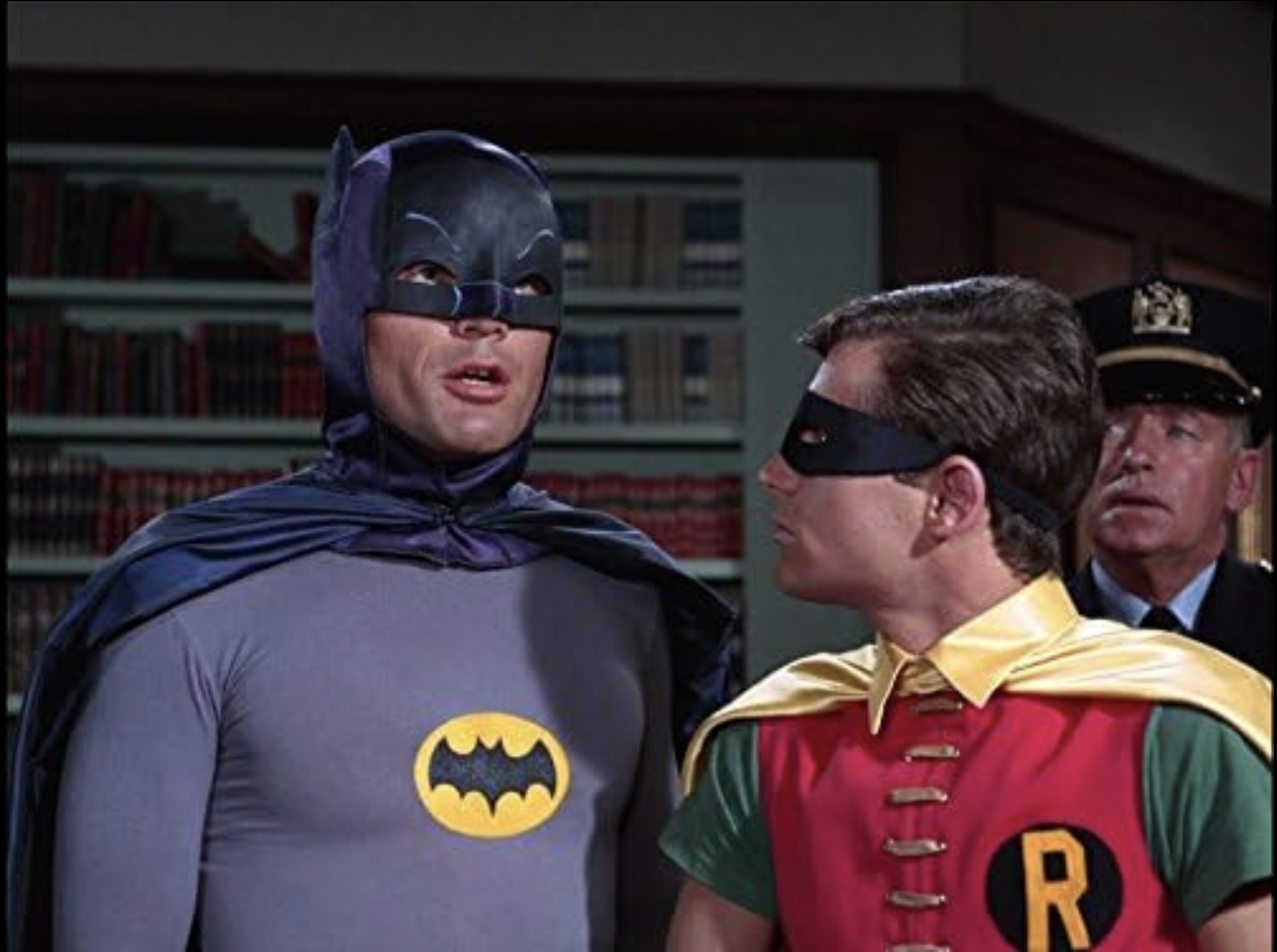 <p>A campy classic, "Batman" was a pop-art explosion that had kids rushing to their TV sets.  Featuring Adam West as Batman and Burt Ward as Robin, the show was a campy, colorful interpretation of the comic book hero's adventures. A stark contrast to the darker, grittier versions of Batman that would come later, this series reveled in its own kitsch. Each episode would typically see the dynamic duo facing off against over-the-top villains, played with gusto by guest stars like Cesar Romero as the Joker and Burgess Meredith as the Penguin. Despite its relatively short run, the series made a lasting impact and introduced Batman to a wider audience that may not have been familiar with the comics.</p>