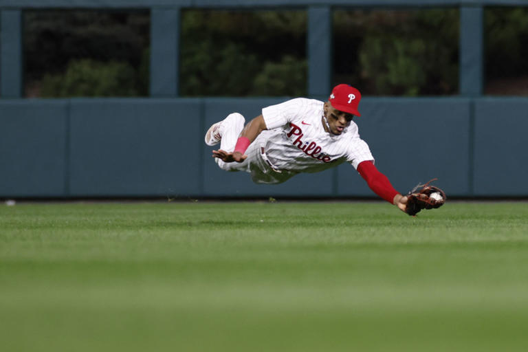 Nice grab: Phillies center fielder Johan Rojas catches a line drive off the bat of Arizona's Tommy Pham in the eighth inning of Game 6. More photos and coverage are at Inquirer.com.
