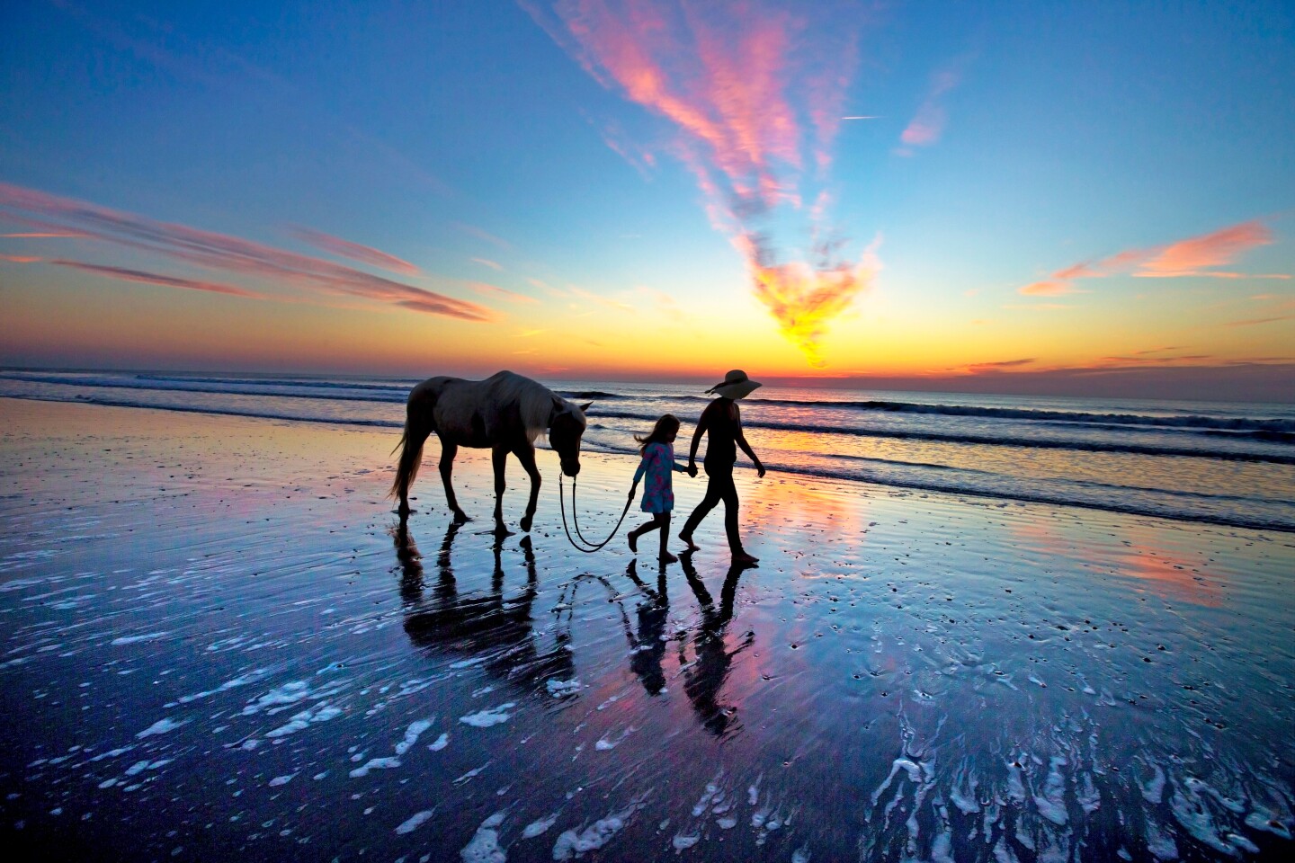 <h2>11. Amelia Island</h2> <ul>   <li><b>Location:</b> Barrier island on Northern Atlantic coast</li>   <li><b>Come for: </b>uncrowded beaches and horseback riding on the sand</li>  </ul> <p>With 13 miles of unspoiled beaches and Spanish-moss-draped oak trees, this barrier island feels more like a lost-in-time Southern retreat than its palm-lined brethren further south. The quartz-filled sand beaches are framed by 40-feet-tall sand dunes—<a class="Link" href="https://ameliaislandhorsebackriding.com/" rel="noopener">horseback riding along the dunes</a> offers another vantage point of the natural paradise.</p> <p>Beyond the beaches and coastal recreation, Amelia Island is also home to the oldest lighthouse in Florida (first lit by whale oil in 1838) and Florida’s oldest bar, <a class="Link" href="https://www.facebook.com/PalaceSaloon1903/" rel="noopener">the Palace Saloon</a>.</p> <p><b>Where to stay</b></p> <ul>   <li><b>Book now: </b><a class="Link" href="https://ameliaschoolhouseinn.com/" rel="noopener">The Amelia Schoolhouse Inn</a></li>  </ul> <p>Located right in downtown Fernandina Beach on Amelia Island, the <a class="Link" href="https://ameliaschoolhouseinn.com/" rel="noopener">Amelia Schoolhouse Inn</a> served as a school from 1886 until the late 20th century. The boutique hotel has kept historical features like original windows and heart pine floors, but coupled with modern amenities like on-site mini golf and an upscale bar, the Principal’s Office.</p>