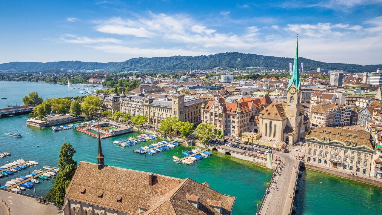 <p>A city transforming into one with a fun night scene and a blossoming foodie scene, Zurich draws visitors from all over. Stroll the shops set amongst the scenery of the lake and snow-capped Alps mountains.</p><p>Even though Switzerland is an expensive country, there are cheap flights to be found. Flying on Swiss Airlines, you could find flights ranging from $540 to $700 round trip with other options available.</p>