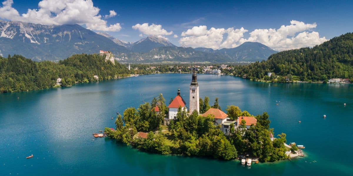 <p>One of the most underrated European cities to visit is Bled, Slovenia. The city of Bled is located in Northwestern Slovenia, close to the border of Austria. </p><p>Bled, Slovenia, is famous for its location at the foot of the Julian Alps and is home to many <a href="https://wanderwithalex.com/famous-landmarks-around-the-world/">famous landmarks</a>, including Lake Bled, Bled Castle, Bled Island, and the Triglav National Park.</p>