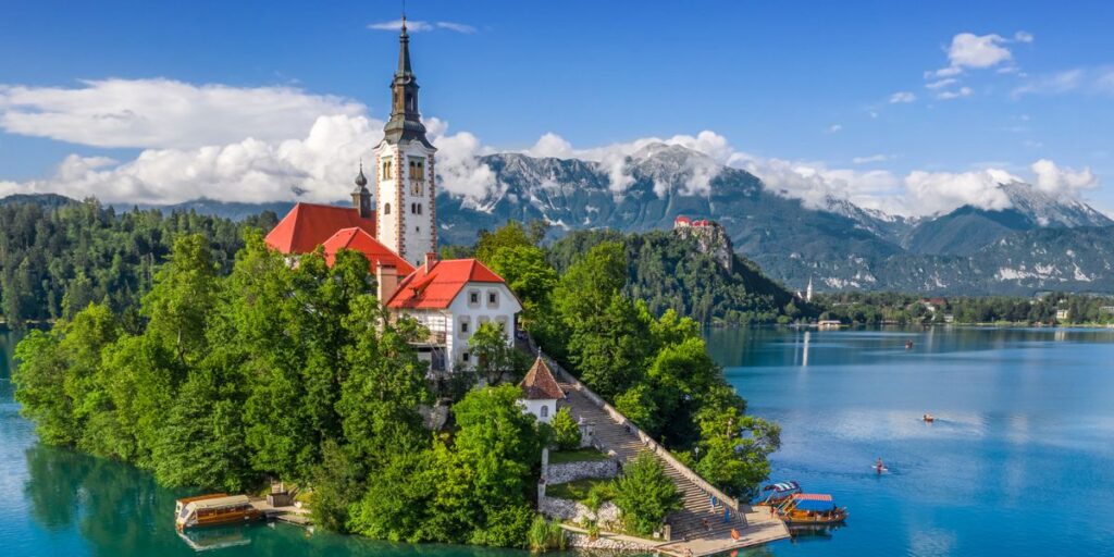 <p>One of the top excursions to embark on in Bled is to make your way to the Assumption of Maria Church on Bled Island. The best way to get to Bled Island is by taking a row boat or hiring a pletna to take you there! Once you get to Bled Island, you must climb 99 stairs to reach the church. </p><p>Not only is the church a beautiful site to take in, but it has a rich history ranging back to the 15th century. </p><p>One of the most popular things to do at the church is to ring the bell three times. <a href="https://travelslovenia.org/bled-island-church/" rel="noreferrer noopener nofollow">Legend has it</a> that if you do so and make a wish, your wish will come true! </p><p>It’s important to note that it does cost a few Euros to see the clock tower, so be sure to have a bit of money on hand when making your way to the island. </p>