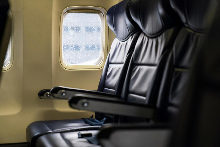 Seats are vacant aboard a Southwest airplane before it takes off on a flight from Providence, R.I. to Orlando, Fla., Wednesday, April 21, 2021.
