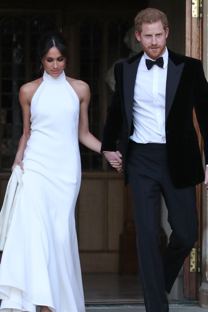 <p>                     Prince Harry and Meghan Markle headed to their evening reception in an icy blue vintage Jaguar.                   </p>                                      <p>                     Both the bride and the groom changed for the party. Prince Harry opted for a tuxedo, and Meghan chose a second bridal gown, made by designer Stella McCartney.                   </p>
