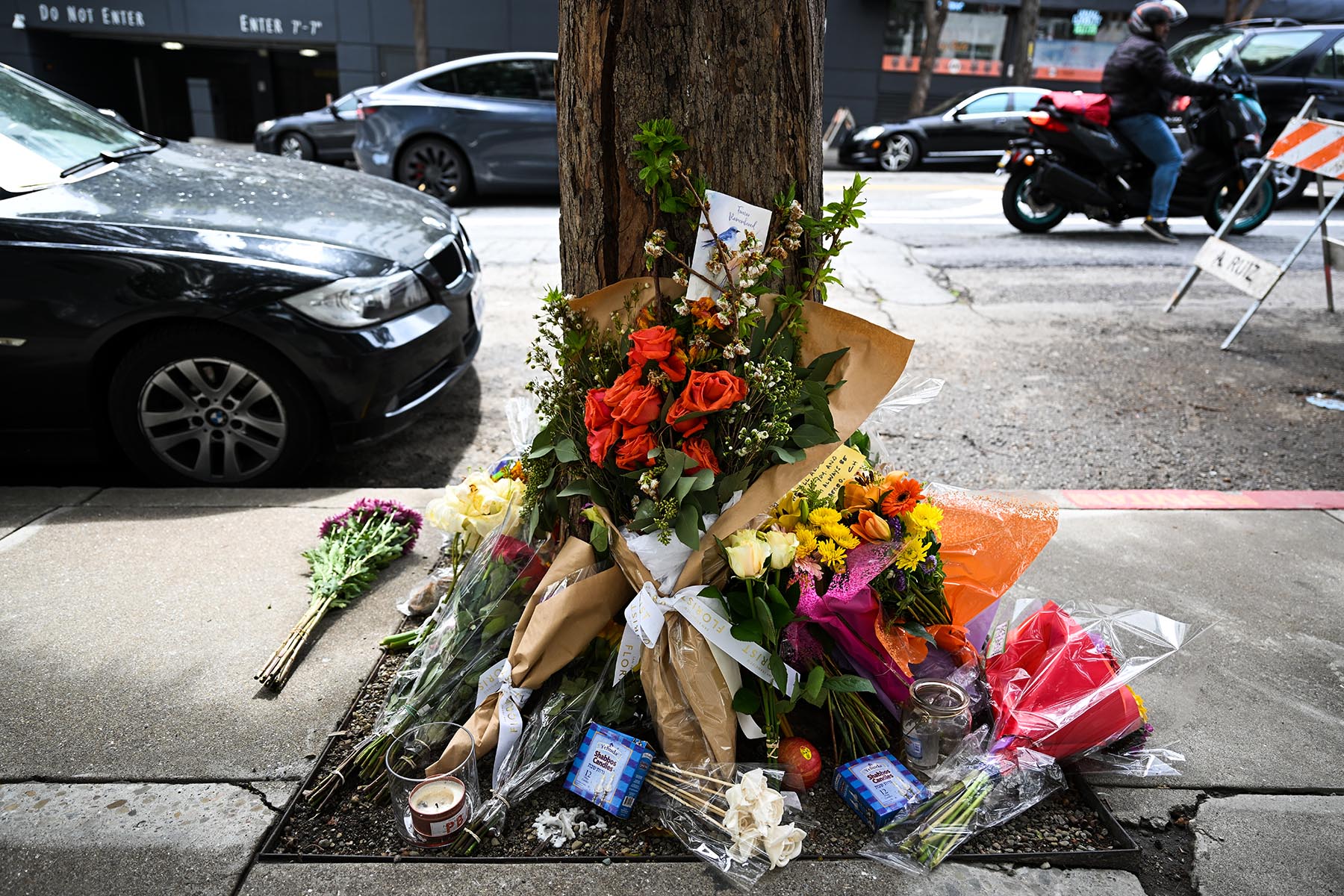 Flowers and cards left as people paying tribute to Bob Lee near the Portside apartment building in San Francisco.
