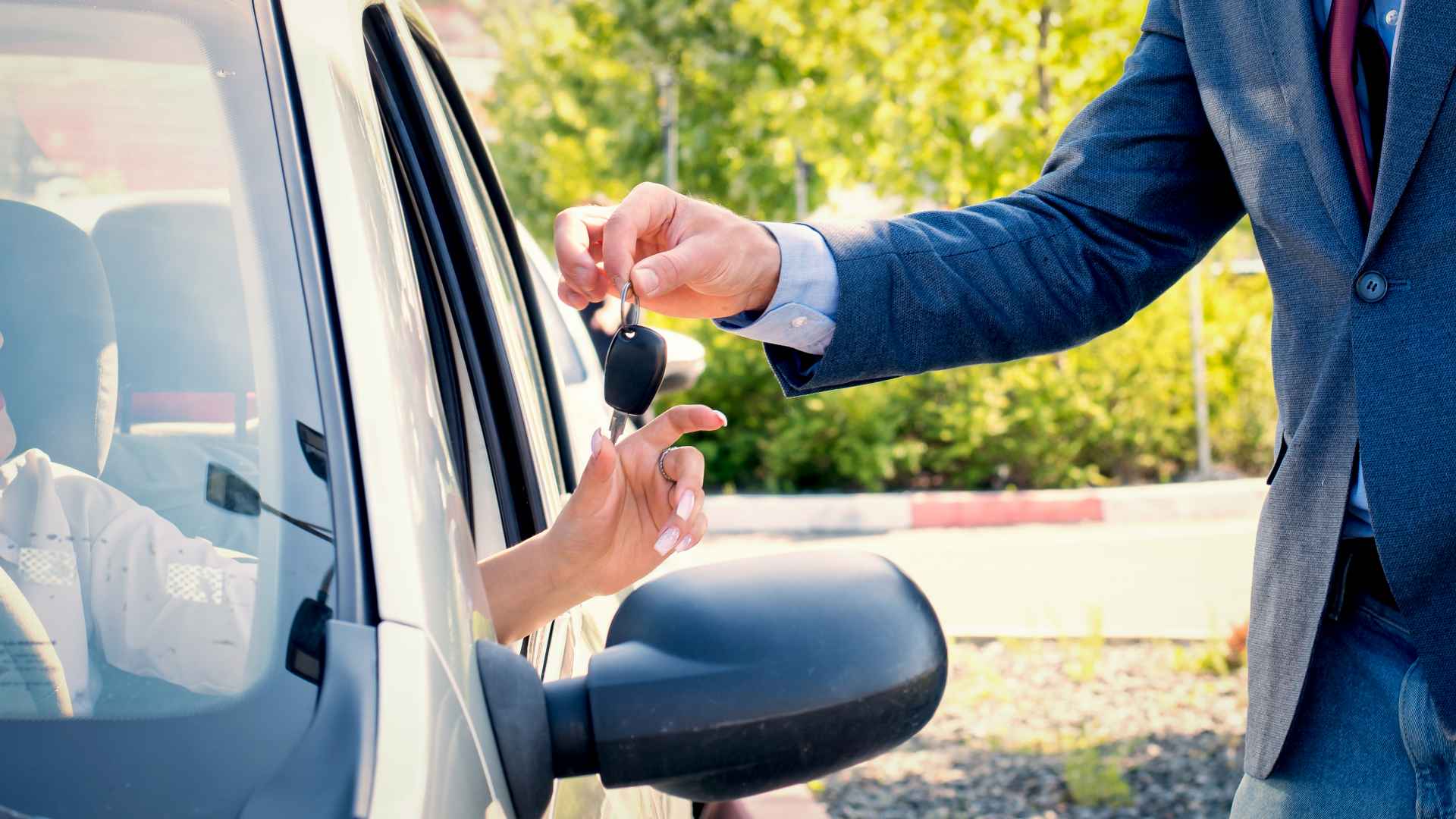 Car salesmen send car keys to new owners.Car rental.