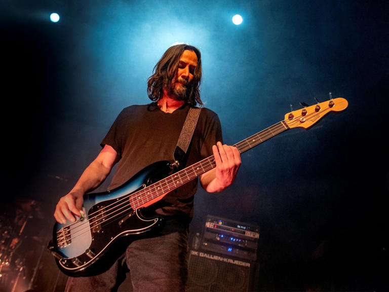 Keanu Reeves manning his bass guitar for Dogstar at a sold-out Mr. Smalls Theatre.