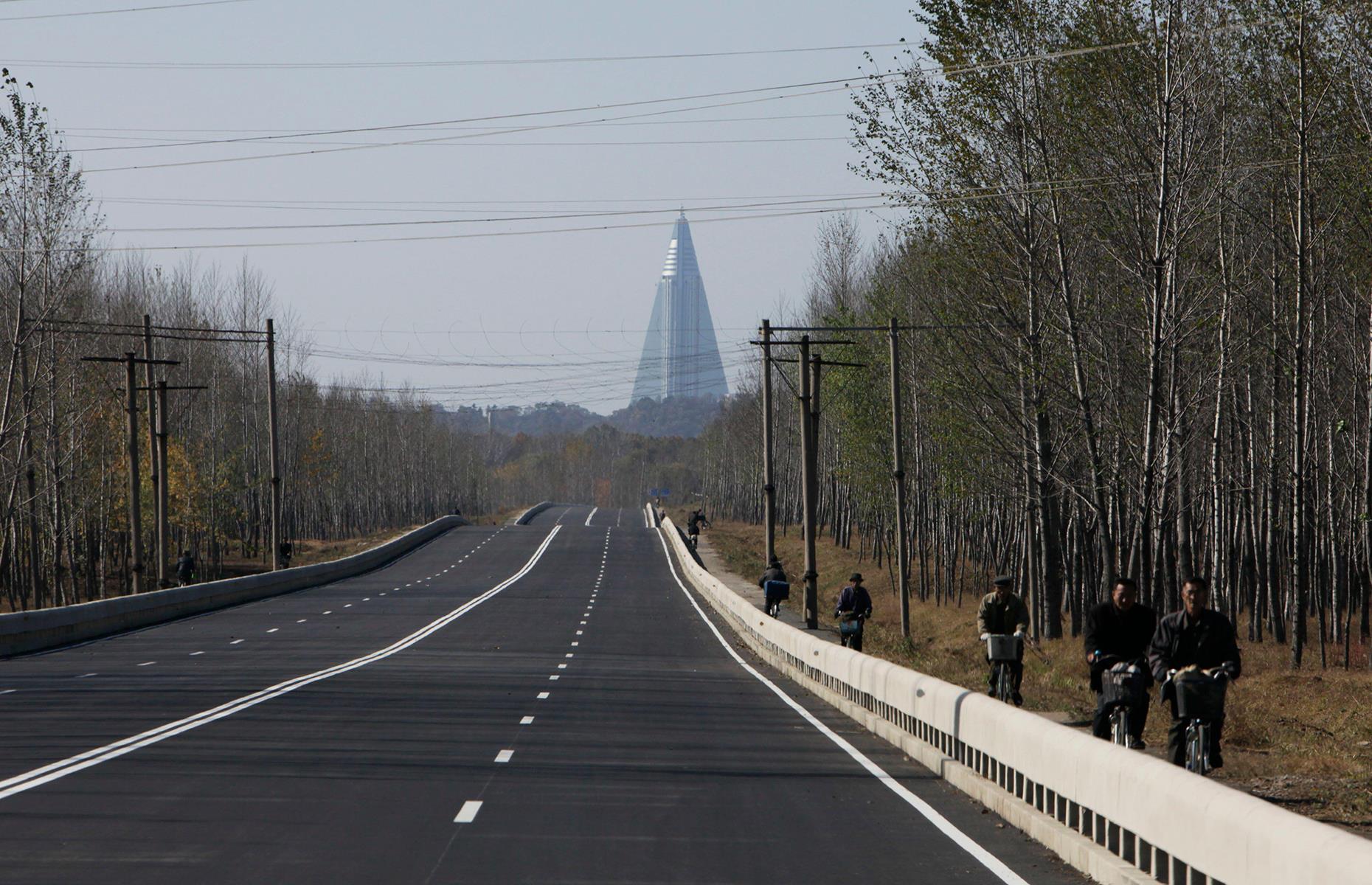 <p>The skyscraper is so much taller than the rest of Pyongyang that it can be seen for miles outside it – here it is pictured in 2011 on a road leading into the city. The hotel was named after a historic nickname for Pyongyang, meaning 'capital of willows'. It was apparently intended to resemble the shape of a willow too, but the retro Soviet design made it look more like a rocket or a missile, leading local guides to sometimes humorously refer to it as 'the missile launch pad'.</p>